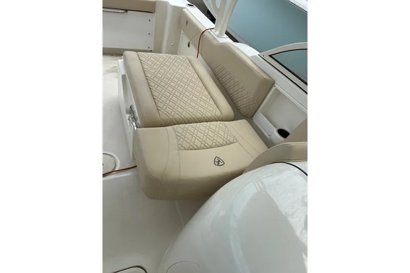 Slide: The Image of Luxurious beige seating on 2021 Century 24 Resorter boat, featuring diamond-pattern upholstery. - 44