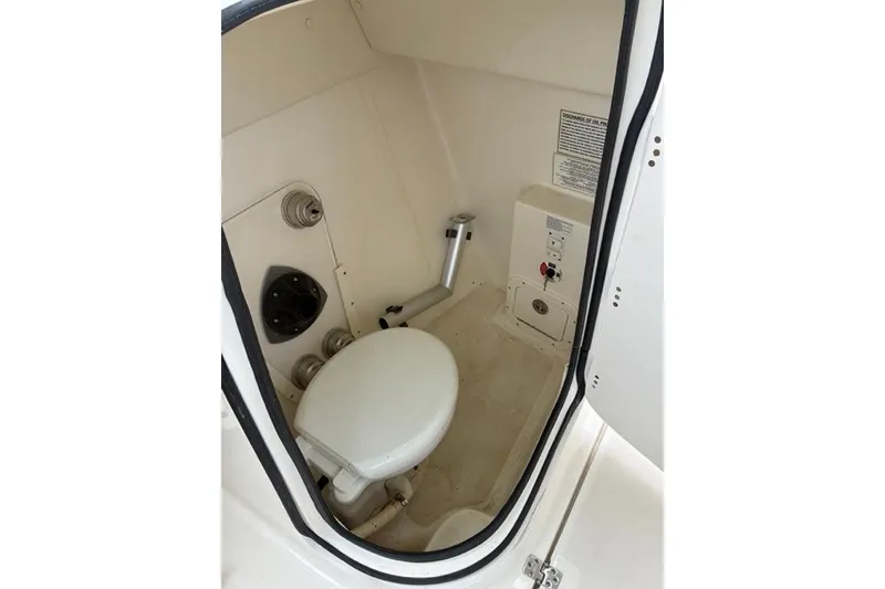 Slide: The Image of Interior of a 2021 Century 24 Resorter boat bathroom with toilet and fixtures. - 55