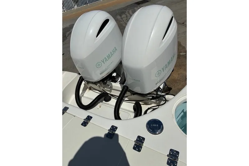 Slide: The Image of Twin Yamaha outboard engines on a 2021 Century 24 Resorter boat. - 35