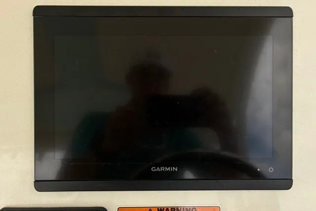 Slide: The Image of Garmin display screen on 2021 Century 24 Resorter boat dashboard. - 36