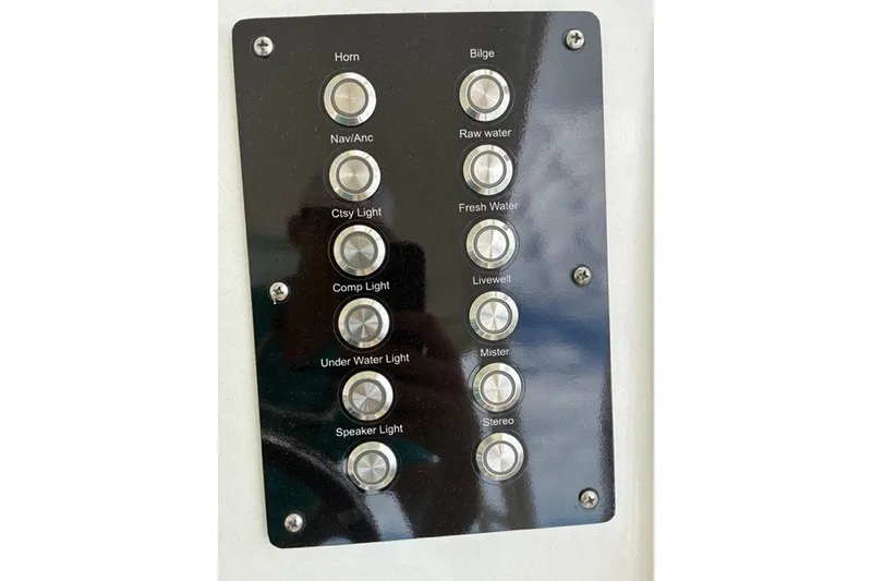 Slide: The Image of Control panel of a 2021 Century 24 Resorter boat with labeled buttons. - 38