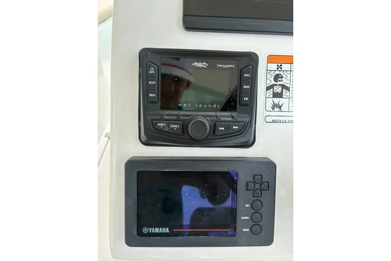 Slide: The Image of Control panel of a 2021 Century 24 Resorter boat with Wet Sounds and Yamaha displays. - 37