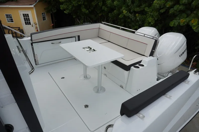 Slide: The Image of 2027 Jeanneau Leader 10.5 WA Series 2 boat deck with seating and table, featuring Yamaha engines. - 3