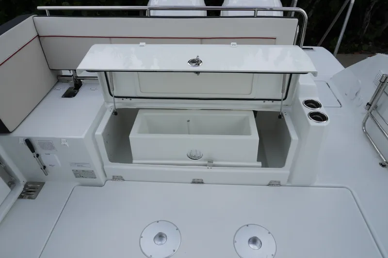Slide: The Image of 2027 Jeanneau Leader 10.5 WA Series 2 boat storage compartment with open lid. - 9