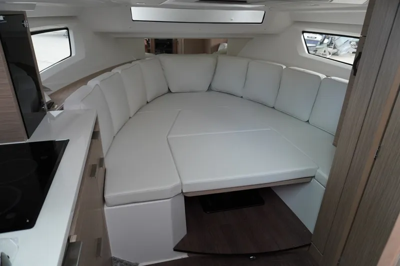 Slide: The Image of Interior of 2027 Jeanneau Leader 10.5 WA Series 2 with white seating area. - 33