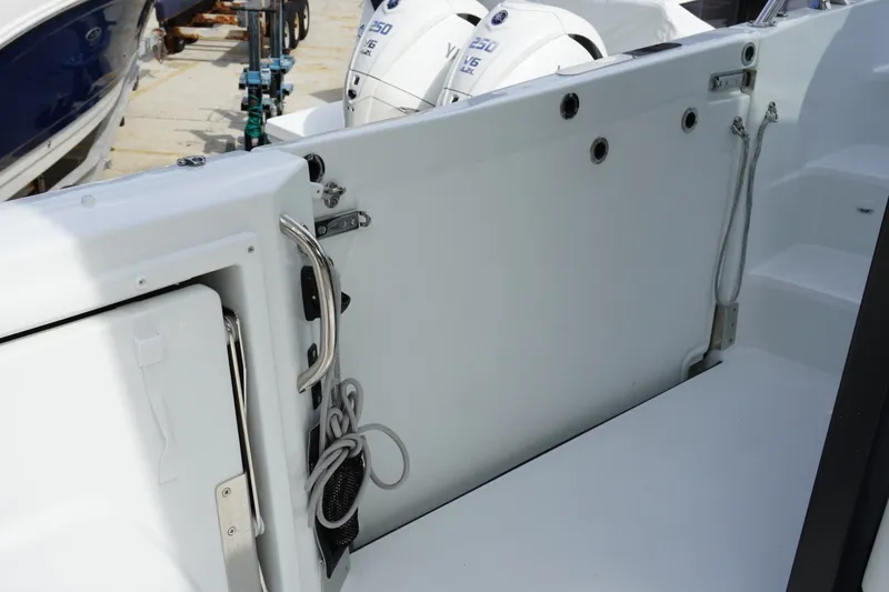 Slide: The Image of 2027 Jeanneau Leader 10.5 WA Series 2 boat deck with ropes and engine view. - 25