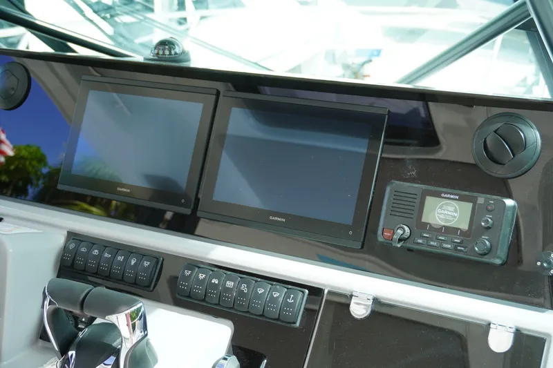 Slide: The Image of Cockpit dashboard of 2027 Jeanneau Leader 10.5 WA Series 2 with Garmin displays. - 22