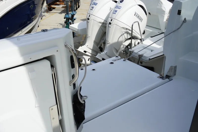 Slide: The Image of 2027 Jeanneau Leader 10.5 WA Series 2 with Yamaha outboard engines, docked. - 26