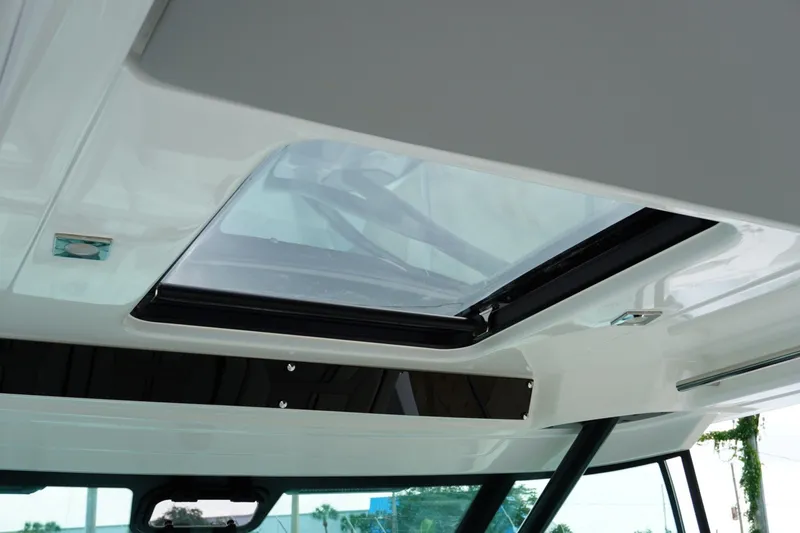 Slide: The Image of 2027 Jeanneau Leader 10.5 WA Series 2 boat interior with skylight view. - 24