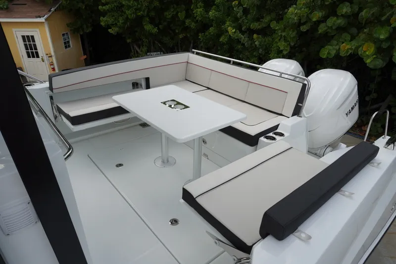 Slide: The Image of 2027 Jeanneau Leader 10.5 WA Series 2 boat with spacious seating and table. - 4