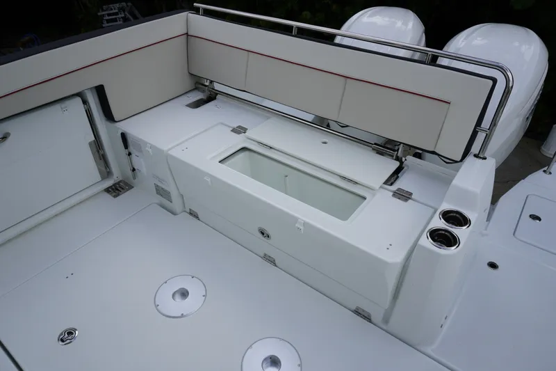 Slide: The Image of 2027 Jeanneau Leader 10.5 WA Series 2 boat deck with seating and storage compartments. - 8