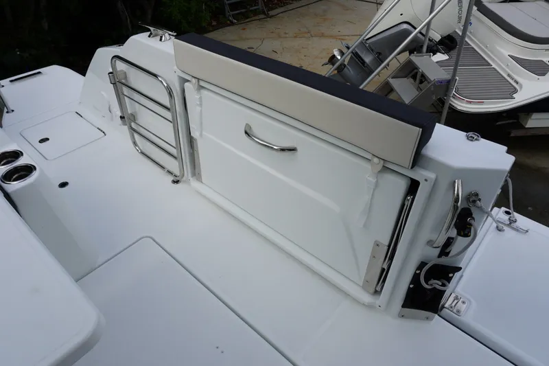 Slide: The Image of 2027 Jeanneau Leader 10.5 WA Series 2 boat deck with seating and stainless steel railing. - 6