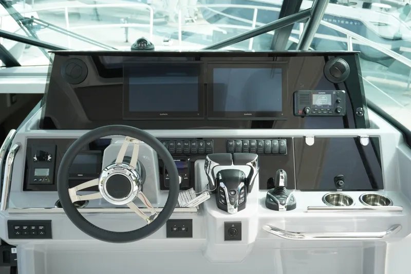 Slide: The Image of Cockpit of 2027 Jeanneau Leader 10.5 WA Series 2 with modern navigation controls. - 19