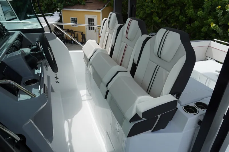 Slide: The Image of 2027 Jeanneau Leader 10.5 WA Series 2 cockpit with modern seating and steering wheel. - 17