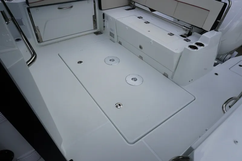 Slide: The Image of 2027 Jeanneau Leader 10.5 WA Series 2 boat deck with seating and storage. - 10