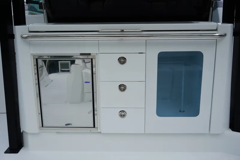 Slide: The Image of 2027 Jeanneau Leader 10.5 WA Series 2 boat interior with sleek cabinetry and storage. - 13