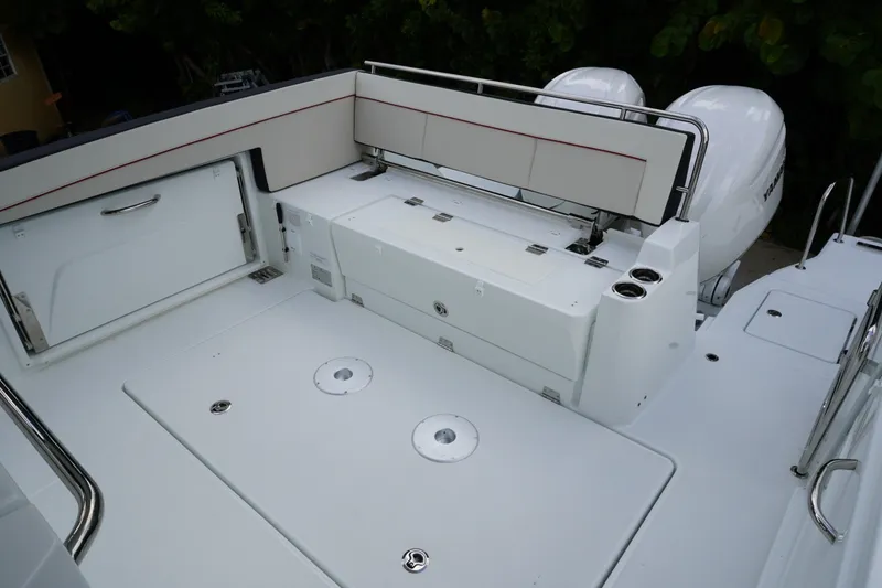 Slide: The Image of 2027 Jeanneau Leader 10.5 WA Series 2 boat deck with seating and storage. - 7