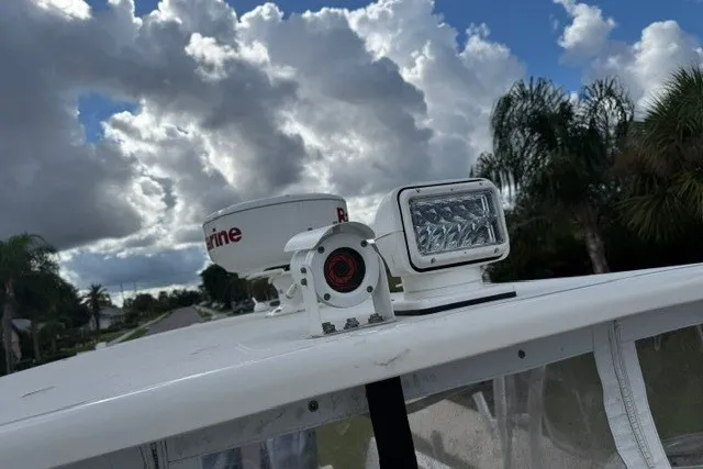 Slide: The Image of 2015 Sailfish 276 DC boat radar and light system under cloudy sky. - 21