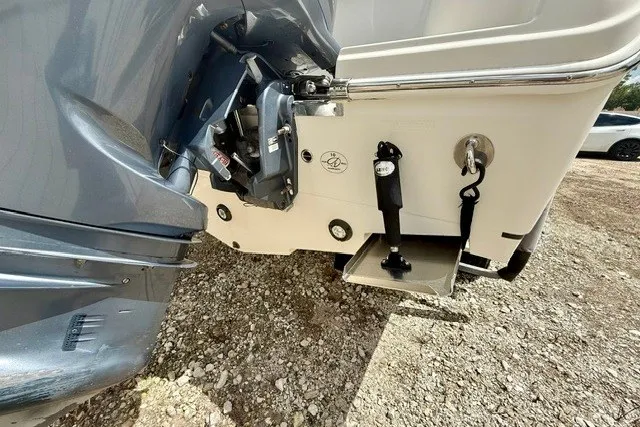 Slide: The Image of 2015 Sailfish 276 DC boat stern with outboard motor and trim tabs. - 17