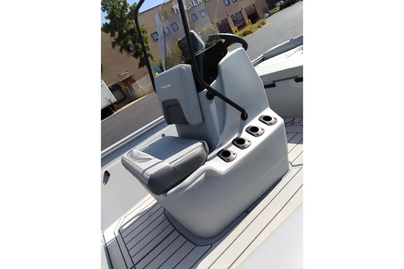 Slide: The Image of 2027 Tracker Bass Tracker 175 CC boat interior with steering console and seating. - 15