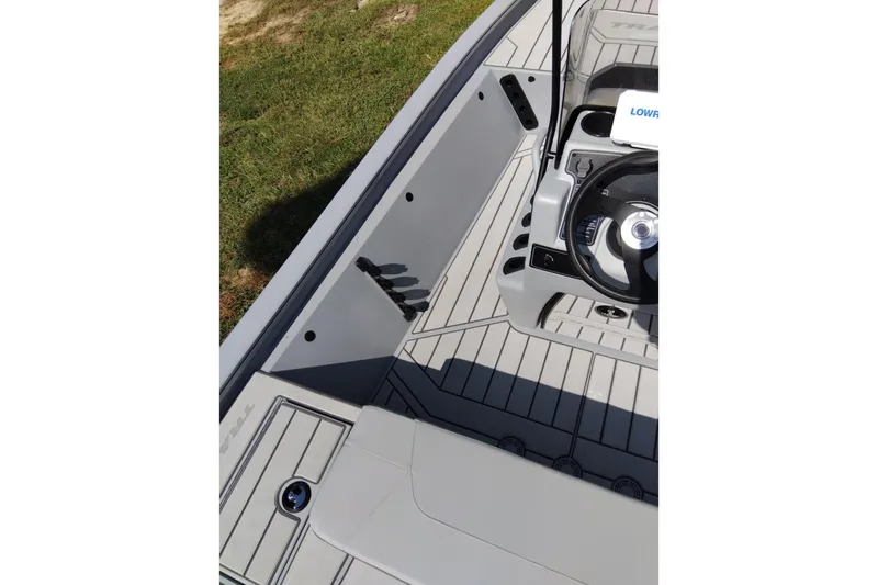 Slide: The Image of 2027 Tracker Bass Tracker 175 CC boat interior with steering wheel and seating area. - 16