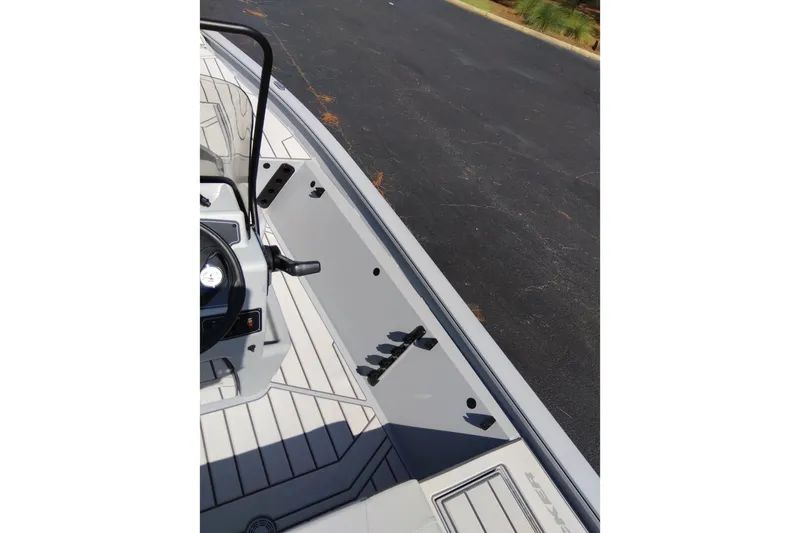 Slide: The Image of 2027 Tracker Bass Tracker 175 CC boat interior with steering wheel and deck view. - 17