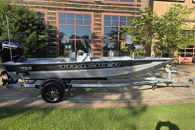 Slide: The Image of 2027 Tracker Bass Tracker 175 CC boat on trailer, parked outdoors. - 44