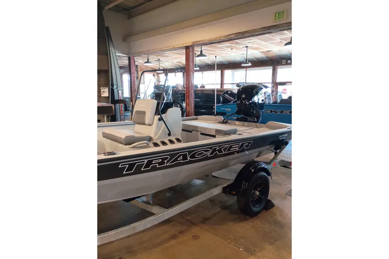 Slide: The Image of 2027 Tracker Bass Tracker 175 CC boat displayed indoors on a trailer. - 47