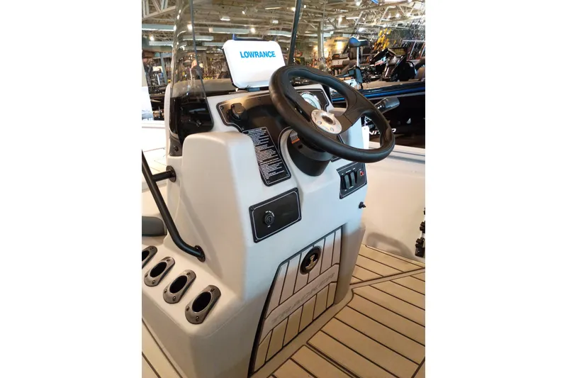 Slide: The Image of 2027 Tracker Bass Tracker 175 CC boat console with steering wheel and Lowrance display. - 48