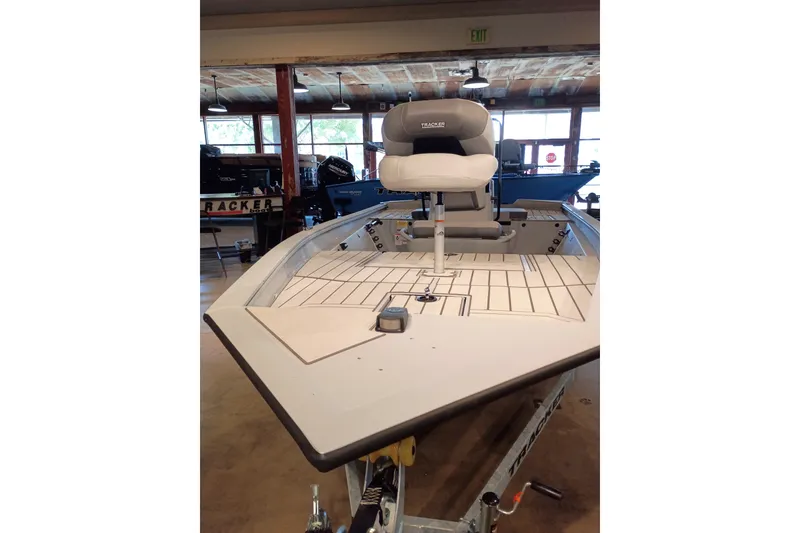 Slide: The Image of 2027 Tracker Bass Tracker 175 CC boat with elevated seat in showroom. - 50