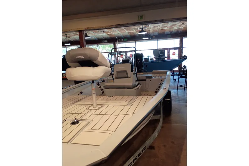 Slide: The Image of 2027 Tracker Bass Tracker 175 CC boat with seating, displayed indoors. - 14