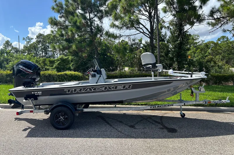 The Image of 2027 Tracker Bass Tracker 175 CC boat on trailer, parked outdoors. - 0