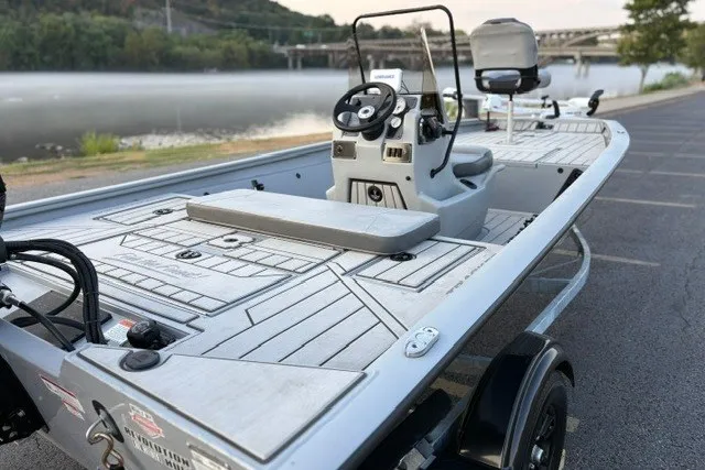 Slide: The Image of 2027 Tracker Bass Tracker 175 CC boat parked by a scenic riverside. - 20