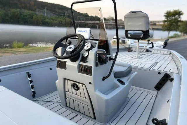 Slide: The Image of 2027 Tracker Bass Tracker 175 CC boat interior with steering console and seating. - 21