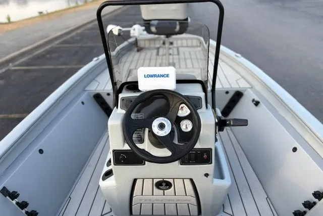 Slide: The Image of 2027 Tracker Bass Tracker 175 CC boat interior with steering wheel and Lowrance navigation system. - 25