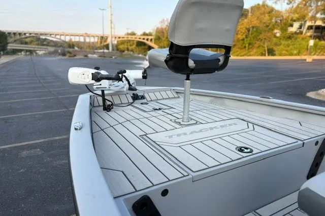 Slide: The Image of 2027 Tracker Bass Tracker 175 CC boat with sleek deck design in a parking area. - 37