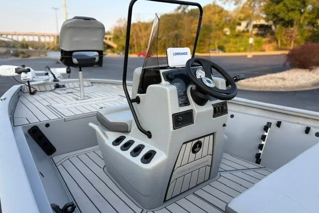Slide: The Image of 2027 Tracker Bass Tracker 175 CC boat interior with steering console and seating. - 18