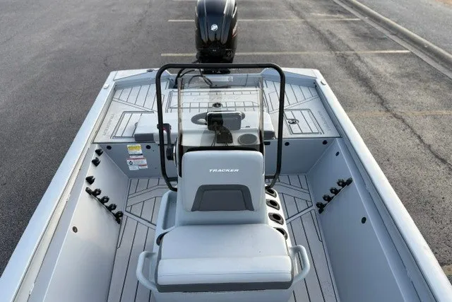 Slide: The Image of 2027 Tracker Bass Tracker 175 CC boat interior with steering console and seating. - 26