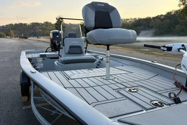 Slide: The Image of 2027 Tracker Bass Tracker 175 CC boat with seating, docked on a calm lake. - 34