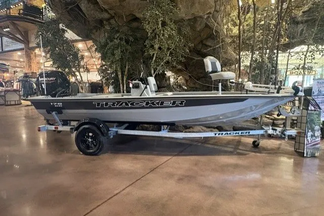 The Image of 2027 Tracker Bass Tracker 175 CC boat displayed indoors on a trailer. - 0