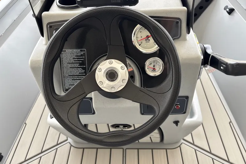 Slide: The Image of Steering console of 2027 Tracker Bass Tracker 175 CC boat with gauges. - 18