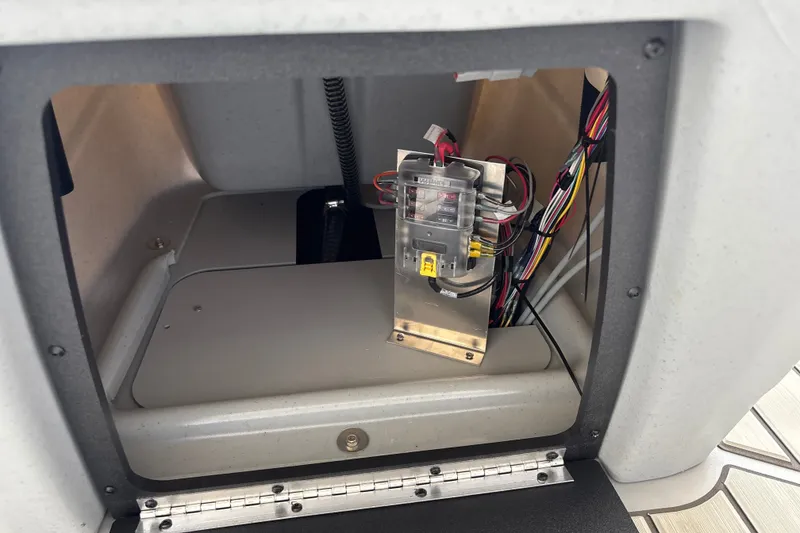 Slide: The Image of Electrical wiring inside a 2027 Tracker Bass Tracker 175 CC boat compartment. - 21