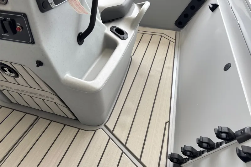 Slide: The Image of Interior of 2027 Tracker Bass Tracker 175 CC boat, featuring sleek design and rod holders. - 14