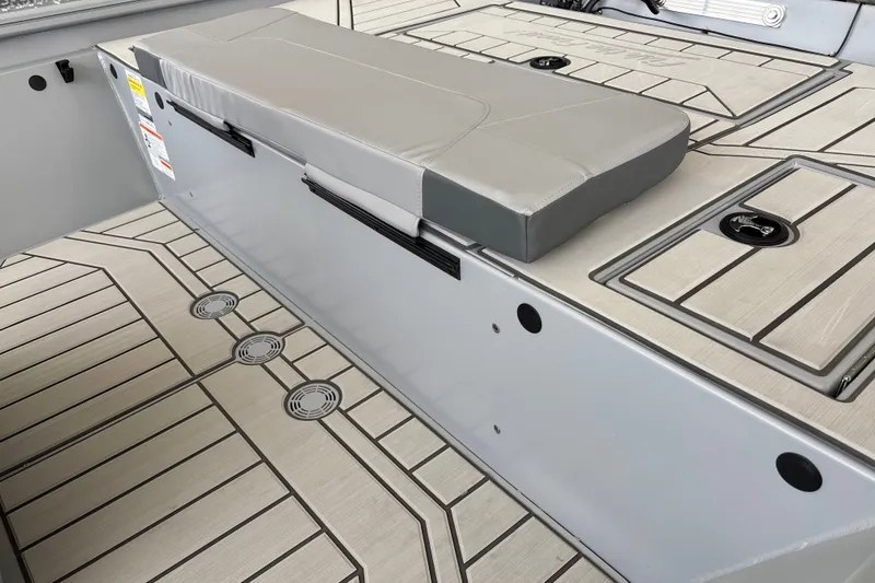 Slide: The Image of 2027 Tracker Bass Tracker 175 CC boat interior with cushioned seating and storage compartments. - 15