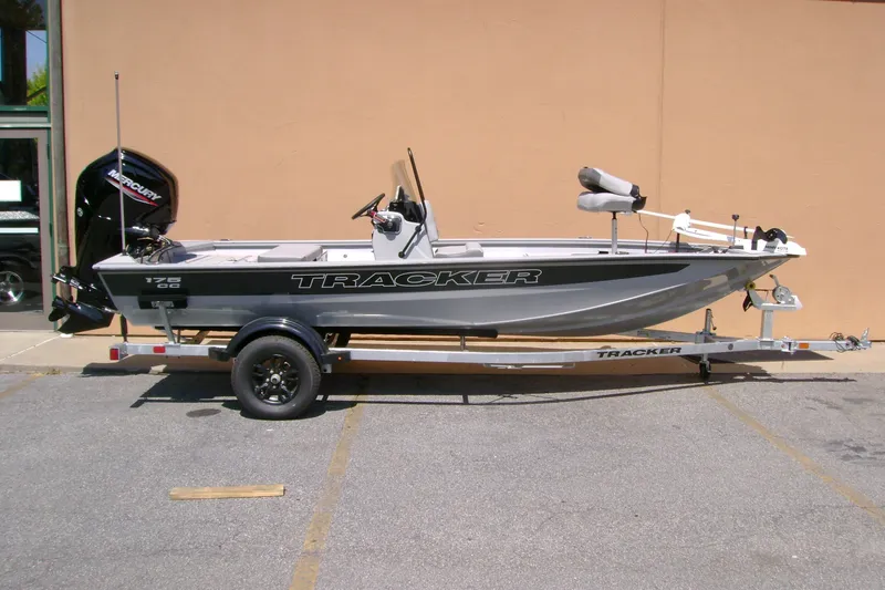 The Image of 2027 Tracker Bass Tracker 175 CC boat on trailer, parked outdoors. - 0