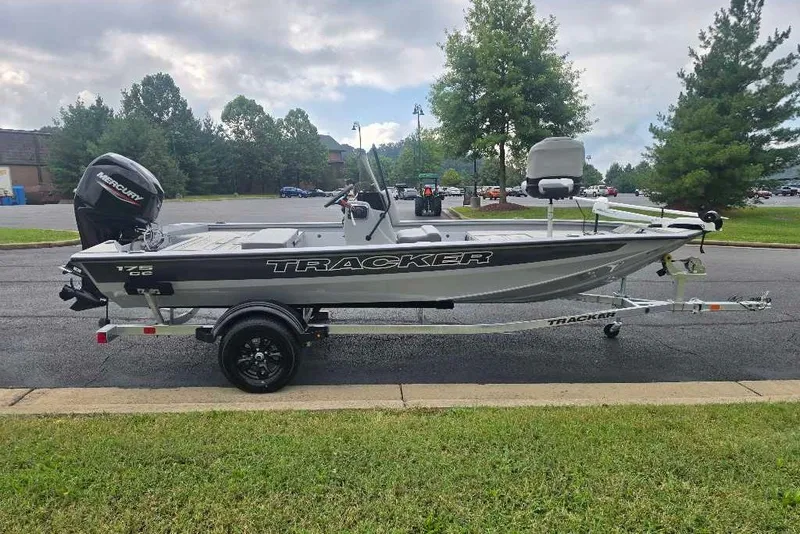 The Image of 2027 Tracker Bass Tracker 175 CC boat on trailer, parked outdoors. - 0