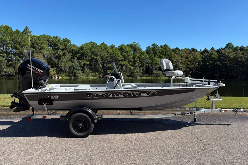 The Image of 2027 Tracker Bass Tracker 175 CC boat on trailer by a lake. - 0