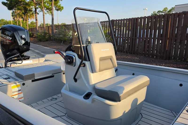 Slide: The Image of 2027 Tracker Bass Tracker 175 CC boat interior with Mercury engine, featuring a central console. - 15