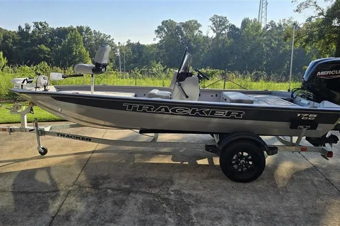 The Image of 2027 Tracker Bass Tracker 175 CC boat on trailer, parked outdoors. - 0
