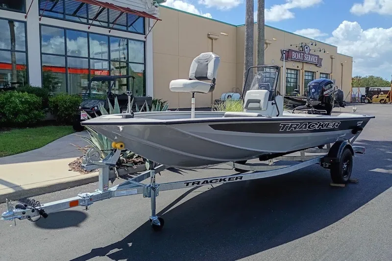 The Image of 2027 Tracker Bass Tracker 175 CC boat on trailer outside a boat service center. - 0
